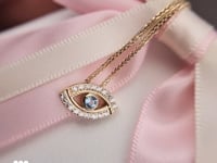 שרשרת עין הרע זהב 14 קראט משובצת יהלומים וטופז כחול